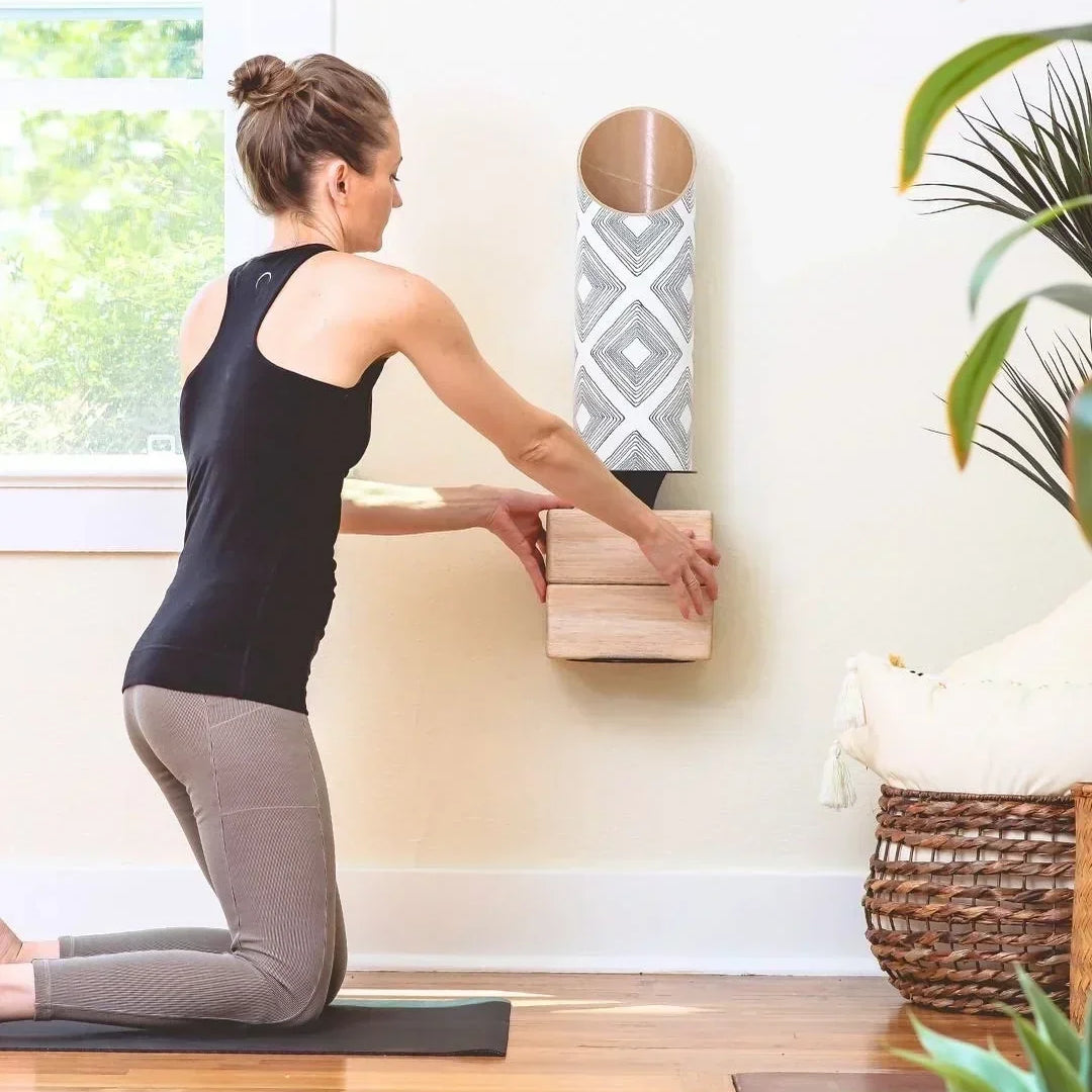 Woman making her yoga storage space by Mache, including a tube for yoga mats with an attached plate for the corks.