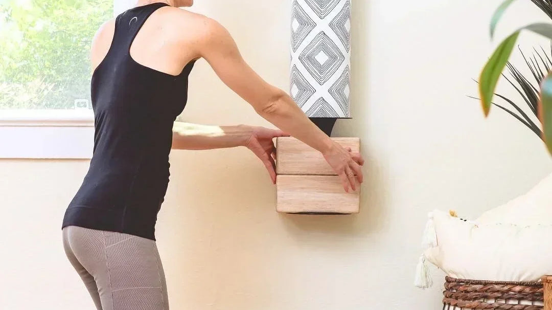 Woman making her yoga storage space by Mache, including a tube for yoga mats with an attached plate for the corks.