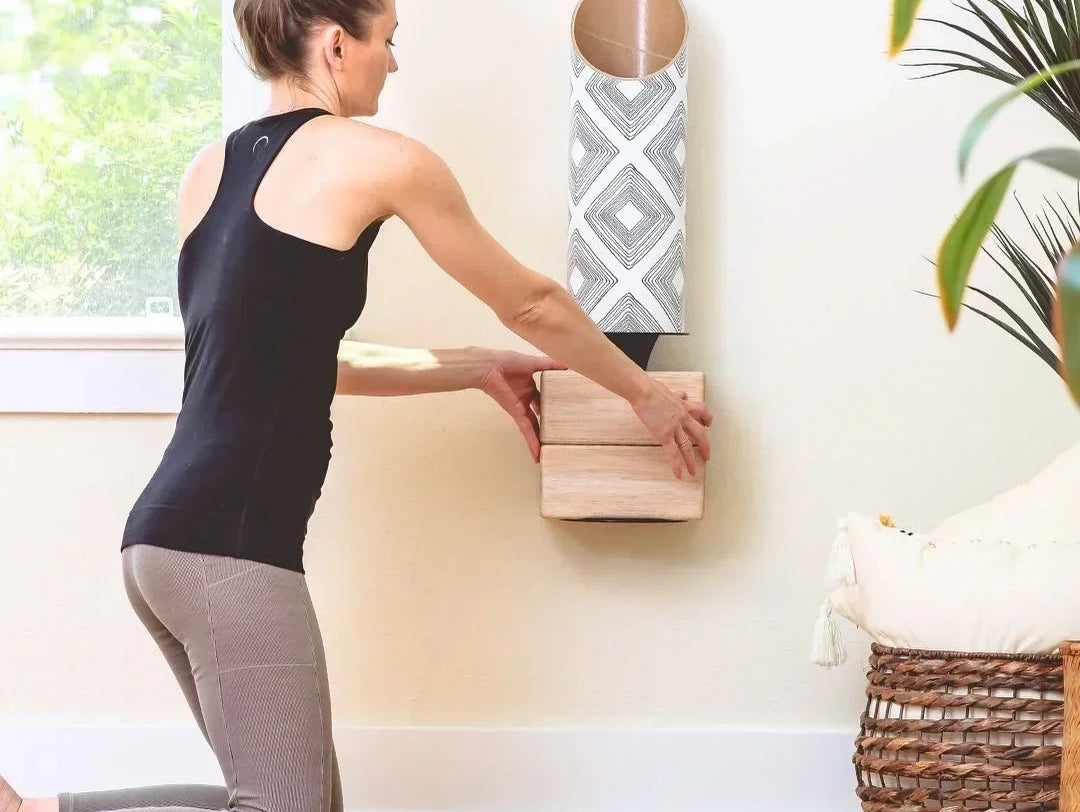 Woman making her yoga storage space by Mache, including a tube for yoga mats with an attached plate for the corks.
