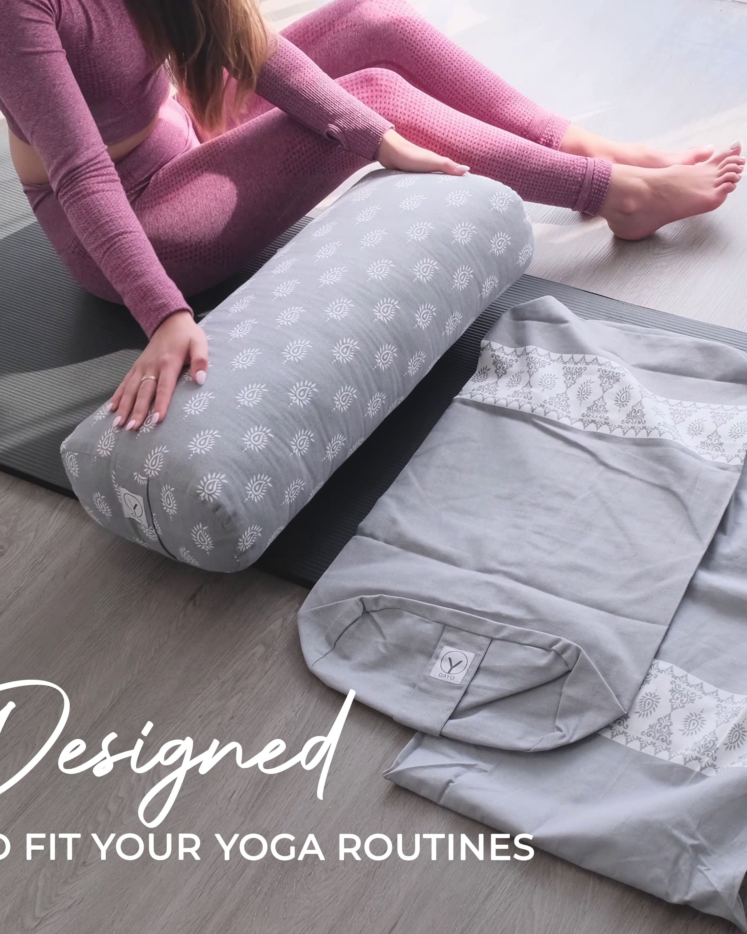 Person using a yoga bolster on a mat with text 'Designed to fit your yoga routines'.