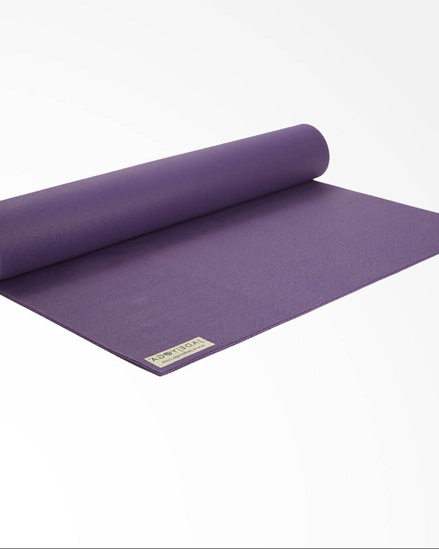 Purple yoga mat with a brand logo on a white background