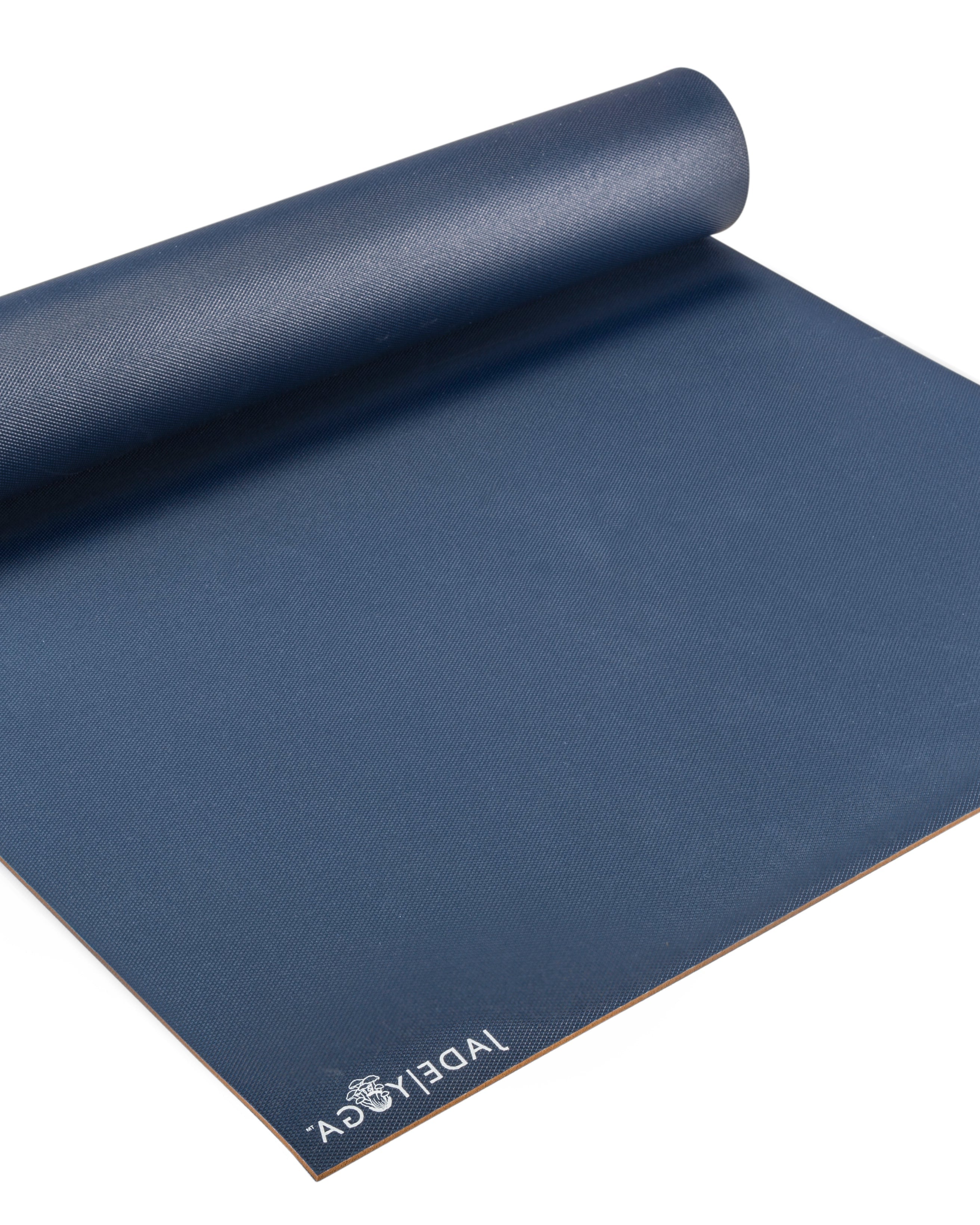 Blue yoga mat with 'Jade Yoga' branding on a white background