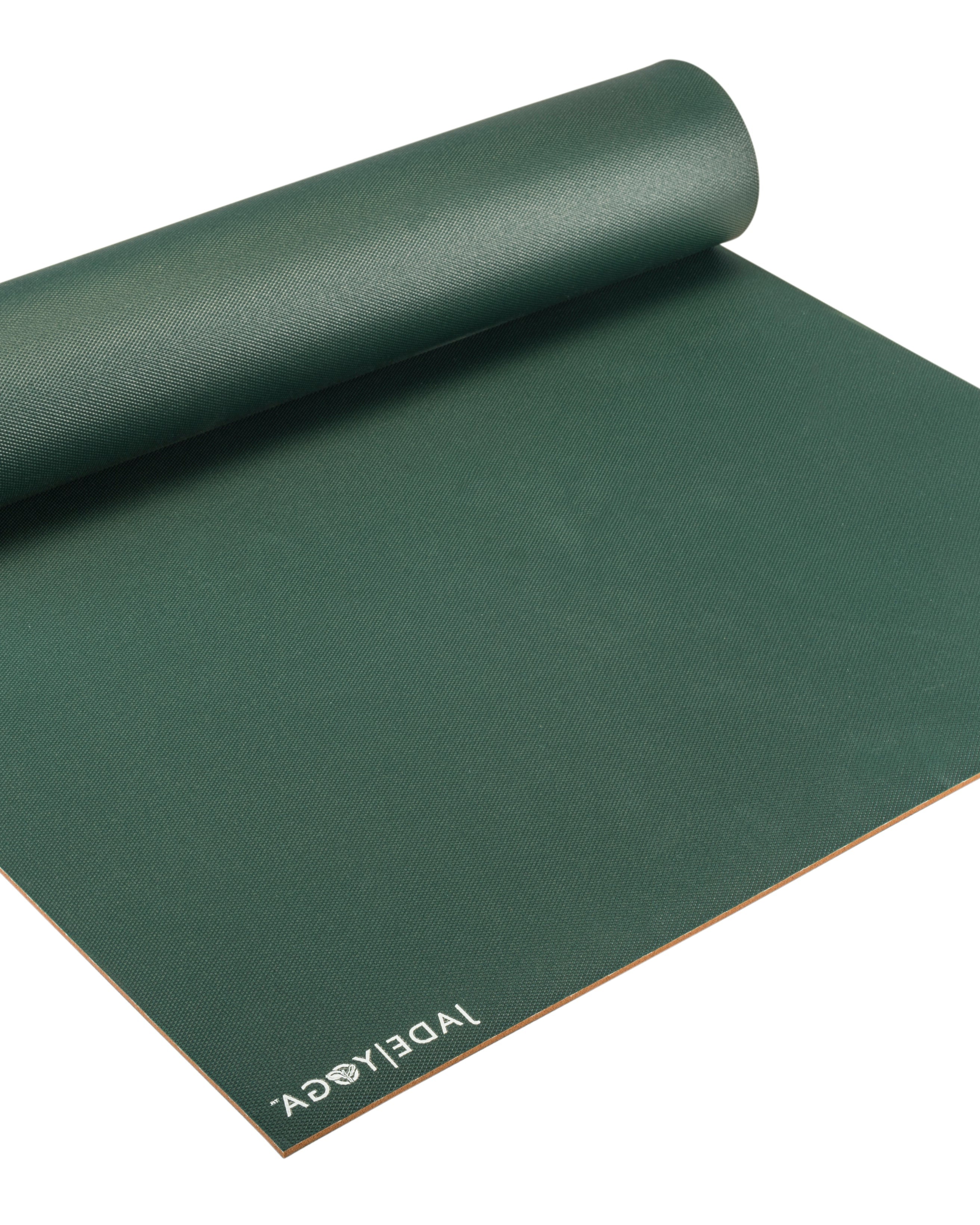 Green yoga mat with 'JADE YOGA' branding on a white background