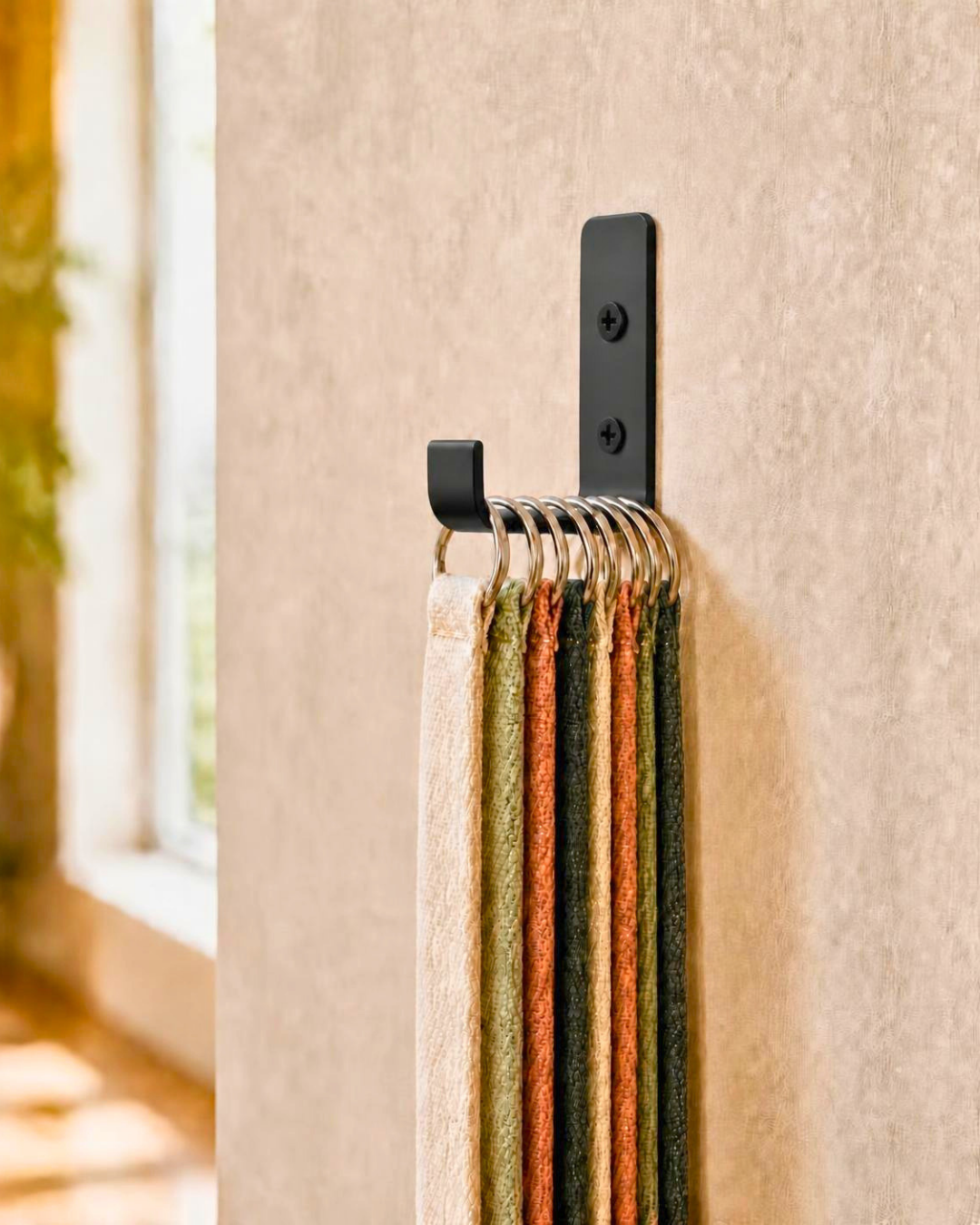 Yoga straps hung by D-ring buckles on a Yoke Hook