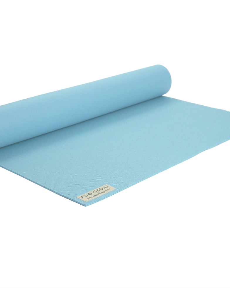 Rolling sky blue yoga mat on a white background