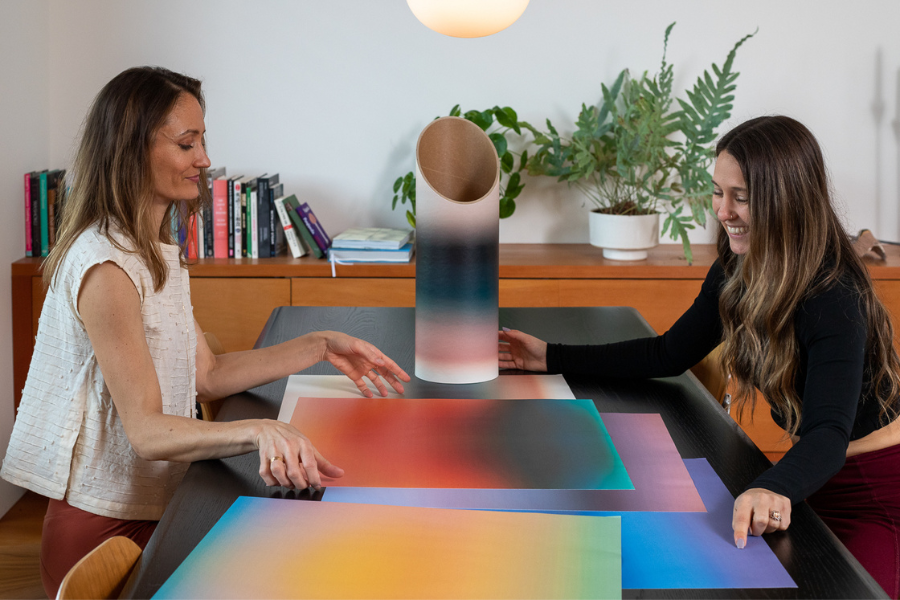 Mache CEO, Brienne Derosier, and Artist Allie Lyon collaborating on designing a limited edition yoga mat storage collection