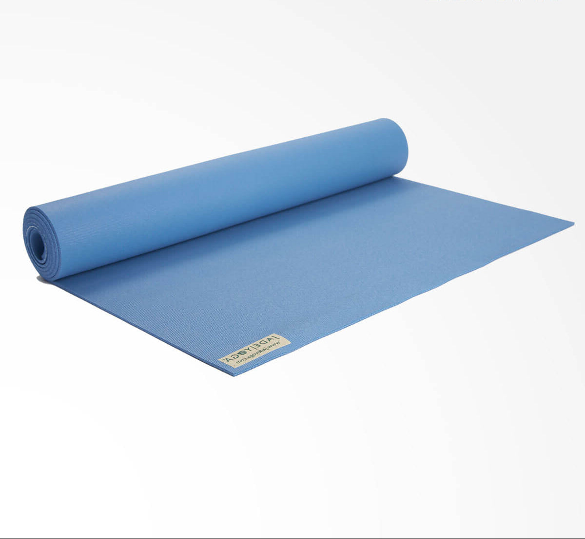 Rolling blue yoga mat with a brand label on a white background