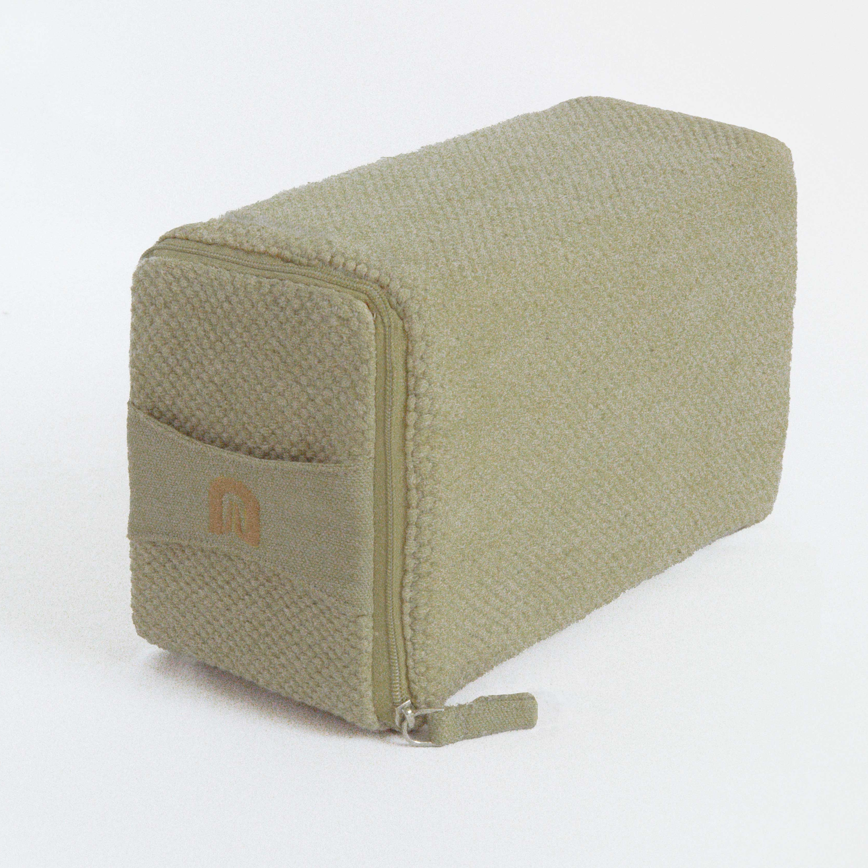 Green textured cotton yoga block with a brand logo on a white background