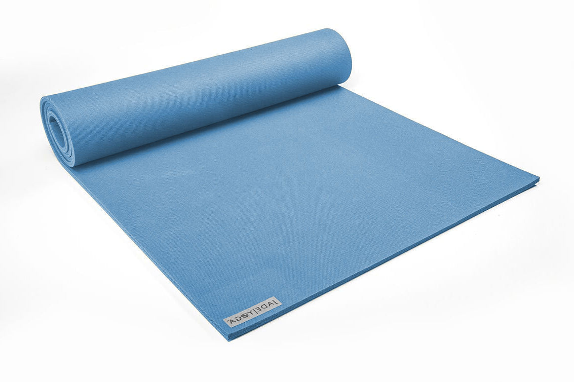 Blue yoga mat with a brand logo on a white background