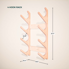 Wooden 4-hook rack with measurements on a beige background